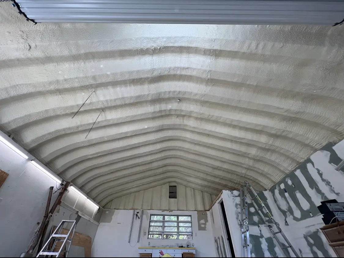 Spray polyurethane foam applied to the underside of a metal roof deck in Grayson Valley